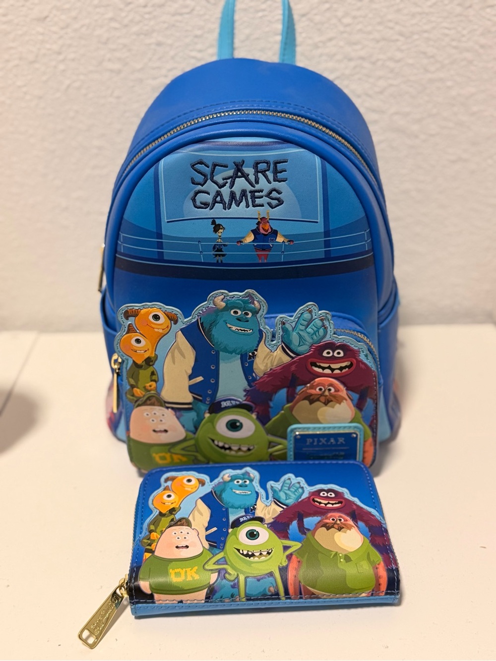 Loungefly Blue Monsters, Inc. 'Scare Games' Mini Backpack with Matching Wallet